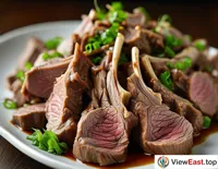 A close-up image showing a plate of freshly sliced mutton, with delicate texture and clear marbling that makes one's mouth water.