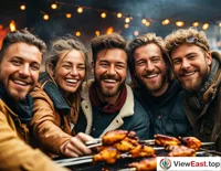 A group of young people at an outdoor barbecue party, enjoying the food while admiring the sunset's afterglow.