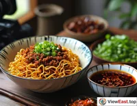 A food blogger is recording a video, showing the audience how to make Zhajiang Noodles at home, with a bowl of tempting sauce beside it.