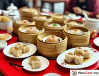  During a cozy family gathering, a large plate of White Cut Chicken takes center stage as family members sit around the table, sharing this traditional delicacy, whose simple and pure flavor is endlessly memorable.