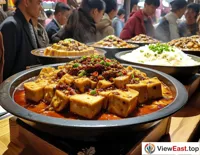 At a food festival, lines form for a taste of authentic Sichuan Mapo Tofu.