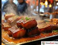 At a food festival stall, the aroma of Braised Pork Belly fills the air, drawing passersby to taste.