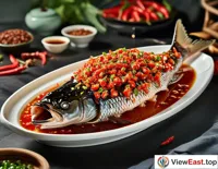Under the lens of food photography, the color and texture of Hunan spicy fish head are perfectly captured, making one's mouth water.