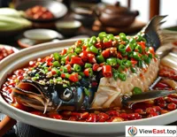During traditional festivals in Hunan, every household prepares spicy fish head as an essential festive dish.