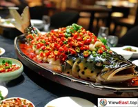 Hunan spicy fish head as the signature dish on a fine dining table, captivating diners with its unique color and aroma.