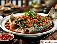A steaming plate of Hunan spicy fish head at a cozy family dinner, with the perfect blend of spicy and fishy flavors.