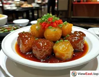 In a high-end hotel's Chinese restaurant, braised pork balls as the signature dish win praise for their light taste and rich layers.