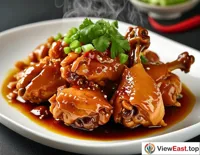 Under the lens of food photography, a freshly cooked plate of Sanbei Chicken has its color and aroma perfectly captured, making one feel its deliciousness just by looking at the picture.