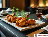 In a private room of a high-end restaurant, Sanbei Chicken is recommended by the chef, offering a visual and tasteful experience with its exquisite presentation and classic flavor.