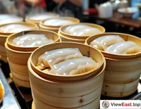 In a Cantonese morning tea shop, steamed Cheong fun is wheeled out in steamers, attracting diners with its translucent appearance.