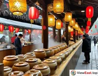 At an outdoor food festival in Jiangxi, a long line forms at the clay pot soup stall, with people eager to taste the authentic Jiangxi flavor.