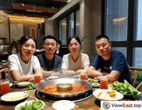 In a Sichuan office, colleagues gather around a hot pot during lunch break, enjoying a quick and tasty meal.