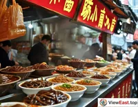 In a Guizhou snack street, a line forms outside a time-honored intestine prosperity noodle shop, with customers looking forward to a bowl of aromatic intestine prosperity noodles.