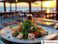 A seafood-topped vegetable salad at a seaside open-air restaurant, with the sea breeze and the setting sun's glow adding a touch of romance.