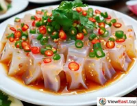 A plate of jellyfish salad as an appetizer at a holiday celebration banquet, setting the stage for the main meal.