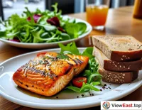 Grilled salmon with whole wheat bread and a fresh salad during office lunchtime, bringing nutrition and vitality to a busy workday.