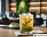 A cup of chilled mung bean soup in a modern office break area, bringing a touch of coolness to a busy workday.