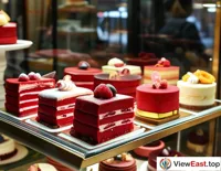 In an exquisite dessert shop, red velvet cakes are displayed in the window, attracting passersby to stop and try a piece.