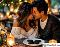 At a romantic couple's dinner, a couple shares heart-shaped chocolate cookies, surrounded by an atmosphere filled with love.