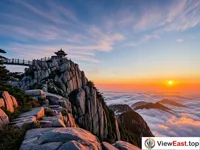 Sunrise at Mount Tai, with the first light illuminating the mountaintops and sea of clouds.