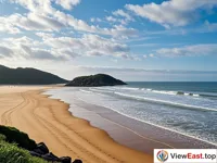 The Thousand Steps Beach in Putuoshan, a winding coastline with fine sand and a gentle sea breeze.