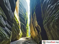 The narrow passage of Wuyi Mountain's One Line Sky, with interlaced light and shadow, exudes an air of mystery 