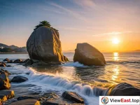 The golden glow of the sunset on Gulang Stone at Gulangyu Island.