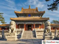 The palace at Chengde Mountain Resort, where the stone lions and the ornate eaves create a magnificent view.