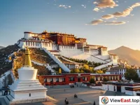 The early morning light illuminates the Potala Palace, where the red and white buildings stand in contrast.